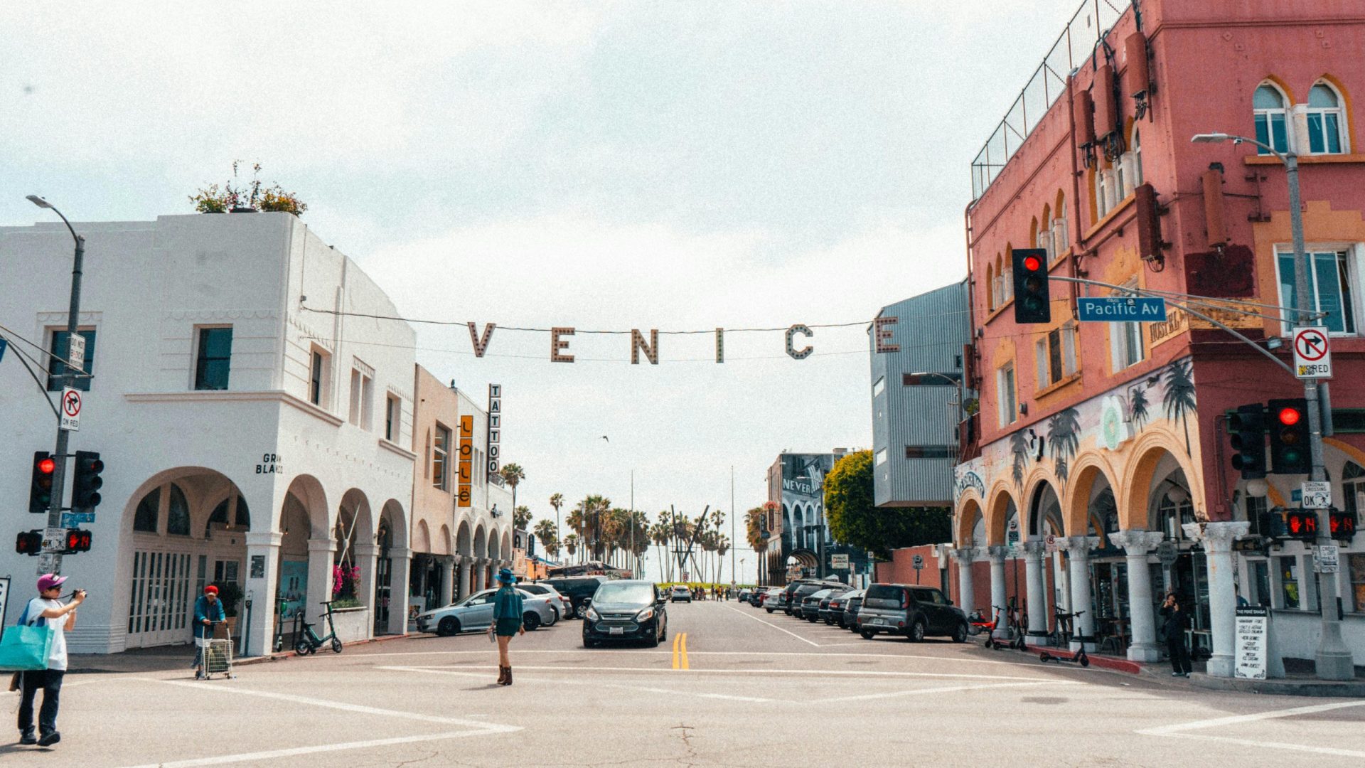 Street view of Venice Beach in Los Angeles, California featuring colorful buildings and lively atmosphere.